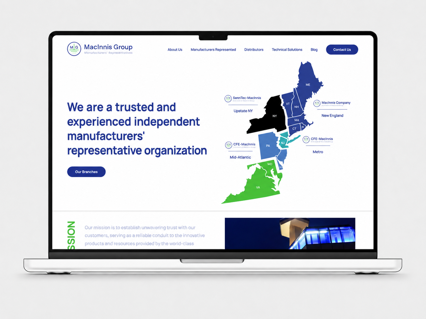MacInnis Group website shown on a laptop